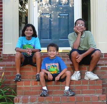 The kids on the doorstep of our old house in Lexington